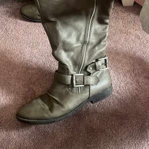 Light brown tall leather boots.